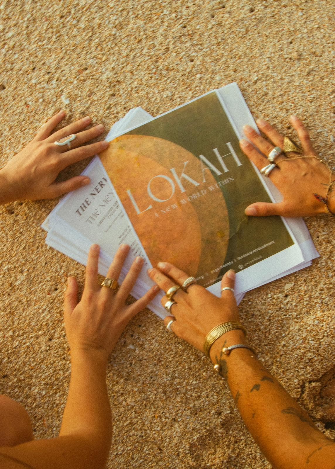 A reader's hands resting on a book